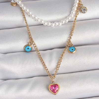 316L Çelik Gold Renk 2'Li İnci Zincir Model Pembe Taşlı Kalp Figür Nazar Boncuk Detay Kadın Kolye
