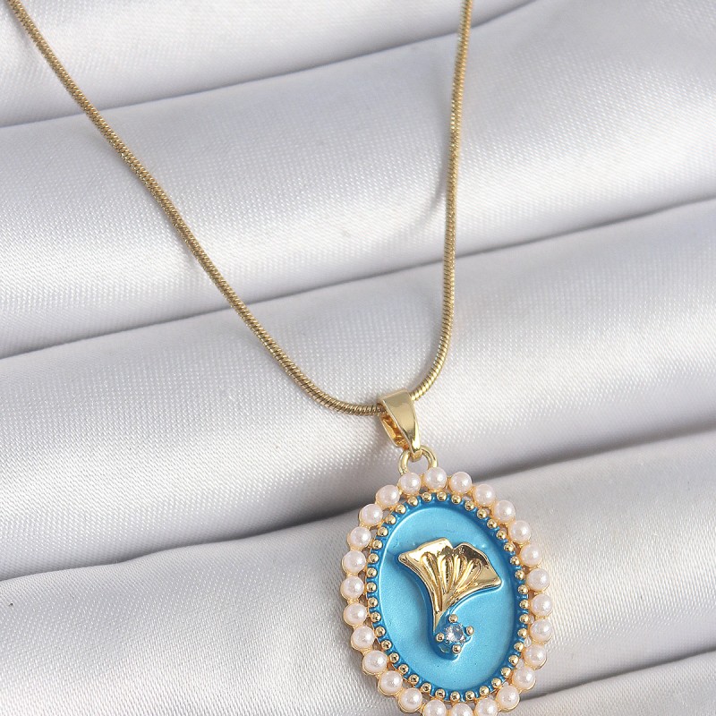 316L Çelik Gold Renk Zincir Mavi Mineli İncili Zirkon Taşlı Çiçek İşlemeli Portre Model Kadın Kolye