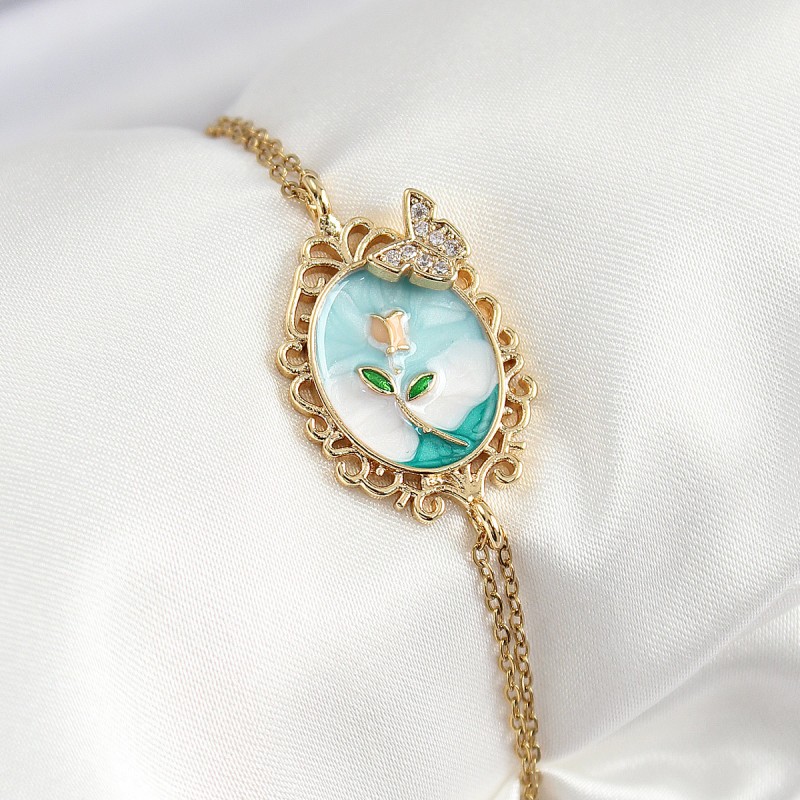 316L Çelik Zincir Mineli Sanatsal Portre Zirkon Taşlı Kelebek Detaylı Çiçek Model Gold Renk Kadın Bileklik